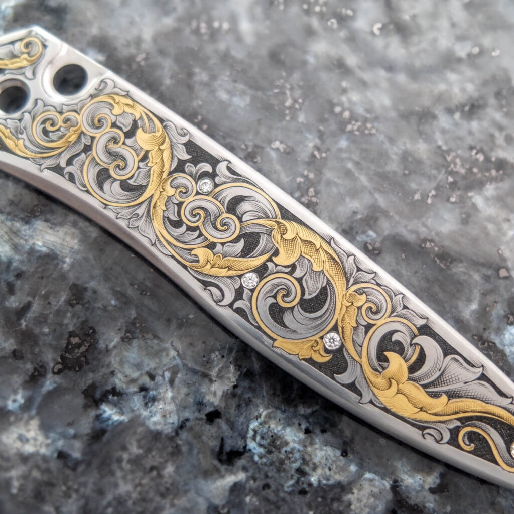 Metal inlay for pocketknives